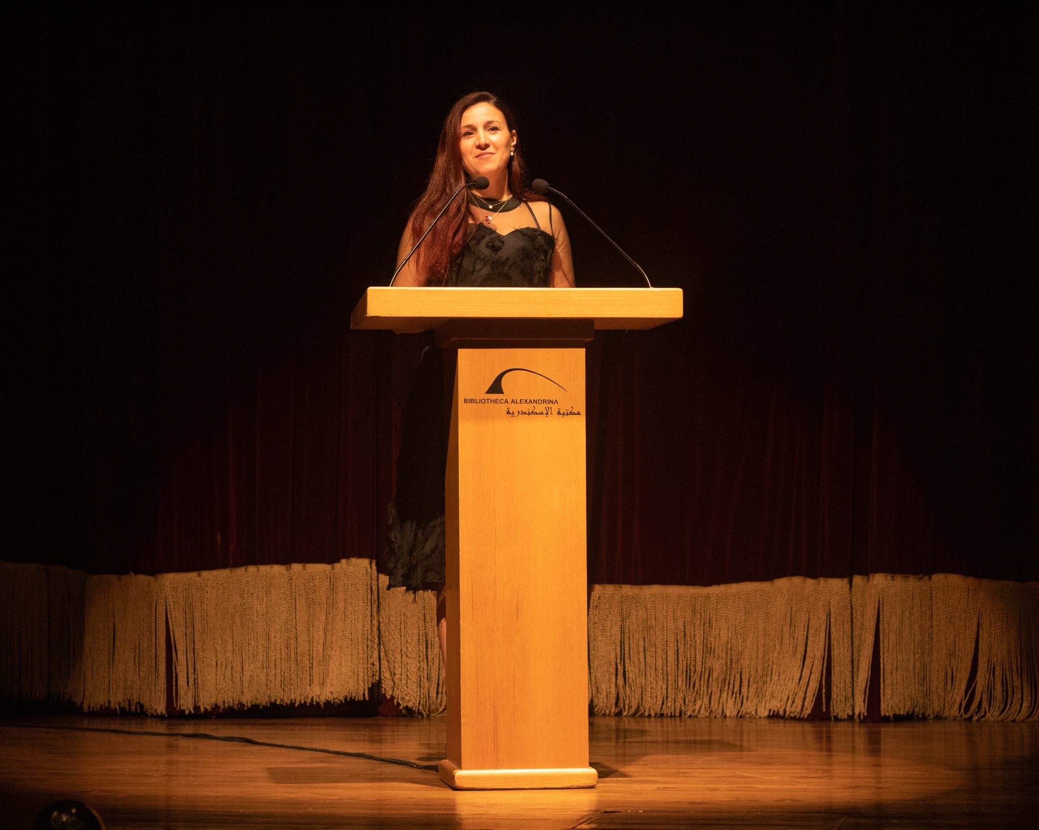 Dr. Reem Kassem speaking at the Bibliotheca Alexandrina podium
